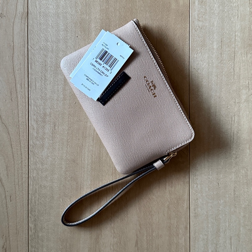 Coach double zip wristlet. Ivory and light saddle. Never used, tags included